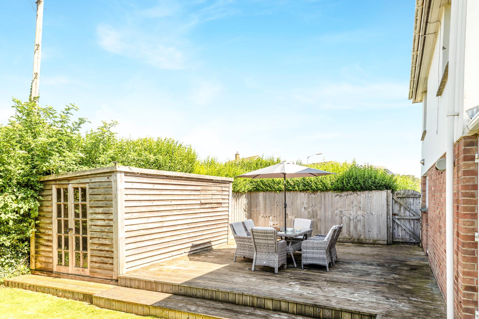 Sit on the decking as the sun goes down with a cocktail in hand!