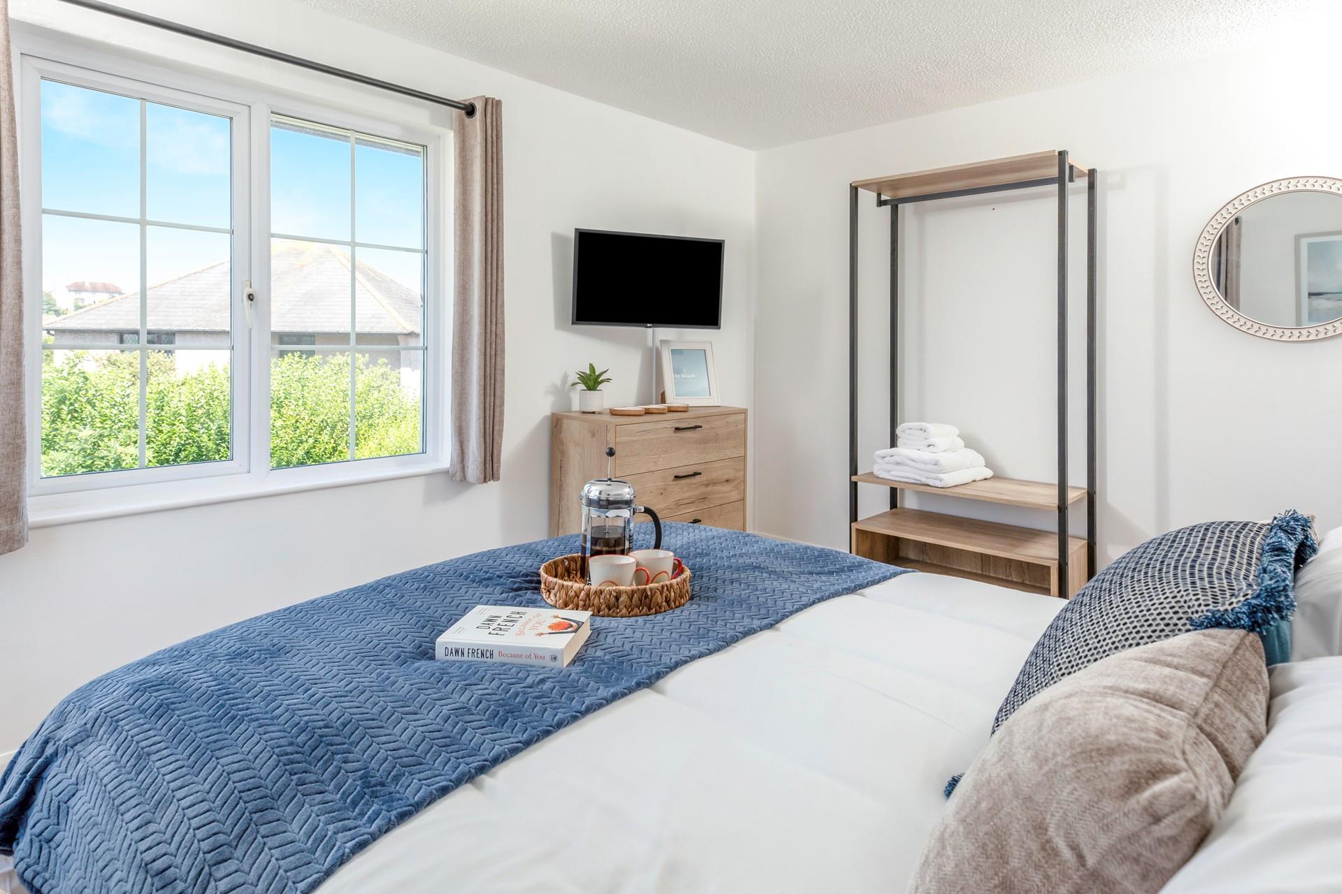 Wake up and check the day's weather to decide on plans.