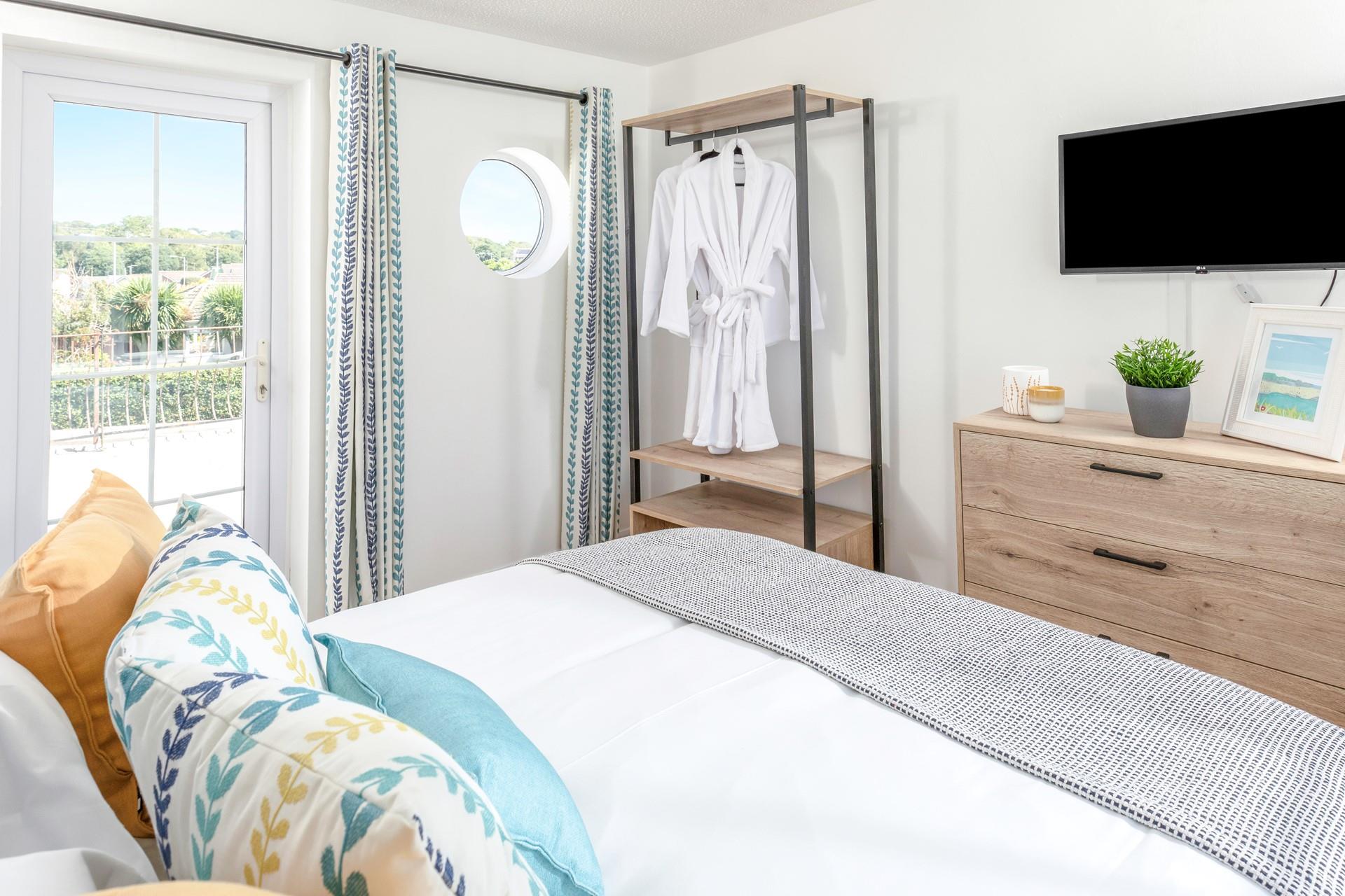 There is plenty of hanging space in the modern bedroom.