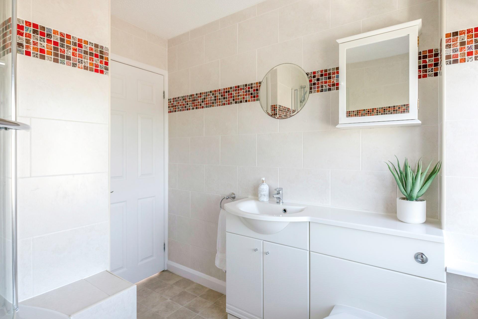The family bathroom is ideal for getting ready each morning.