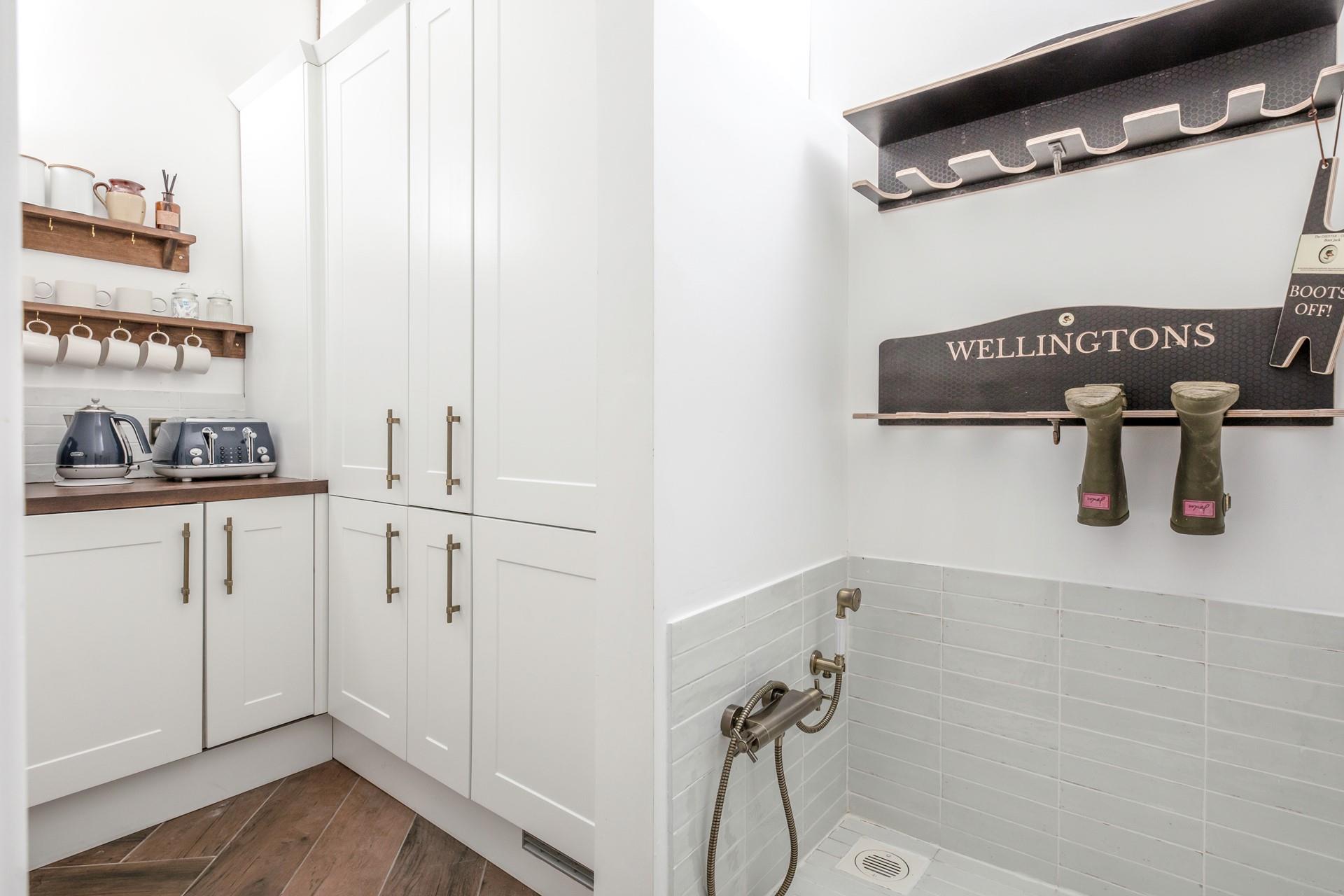 The utility area has a handy dog wash station.