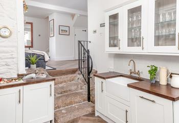 The kitchen has plenty of space for the chef of a family to cook a tasty meal.