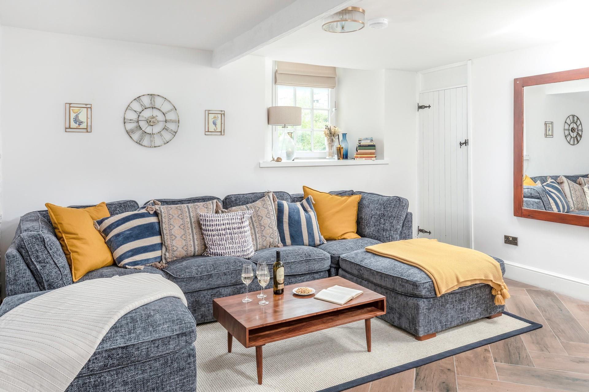 The large U-shaped sofa is perfect for all the family to relax in the evening.