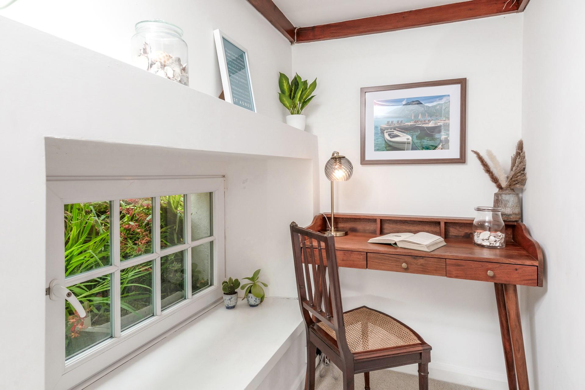 The desk is a handy space to catch up on emails.