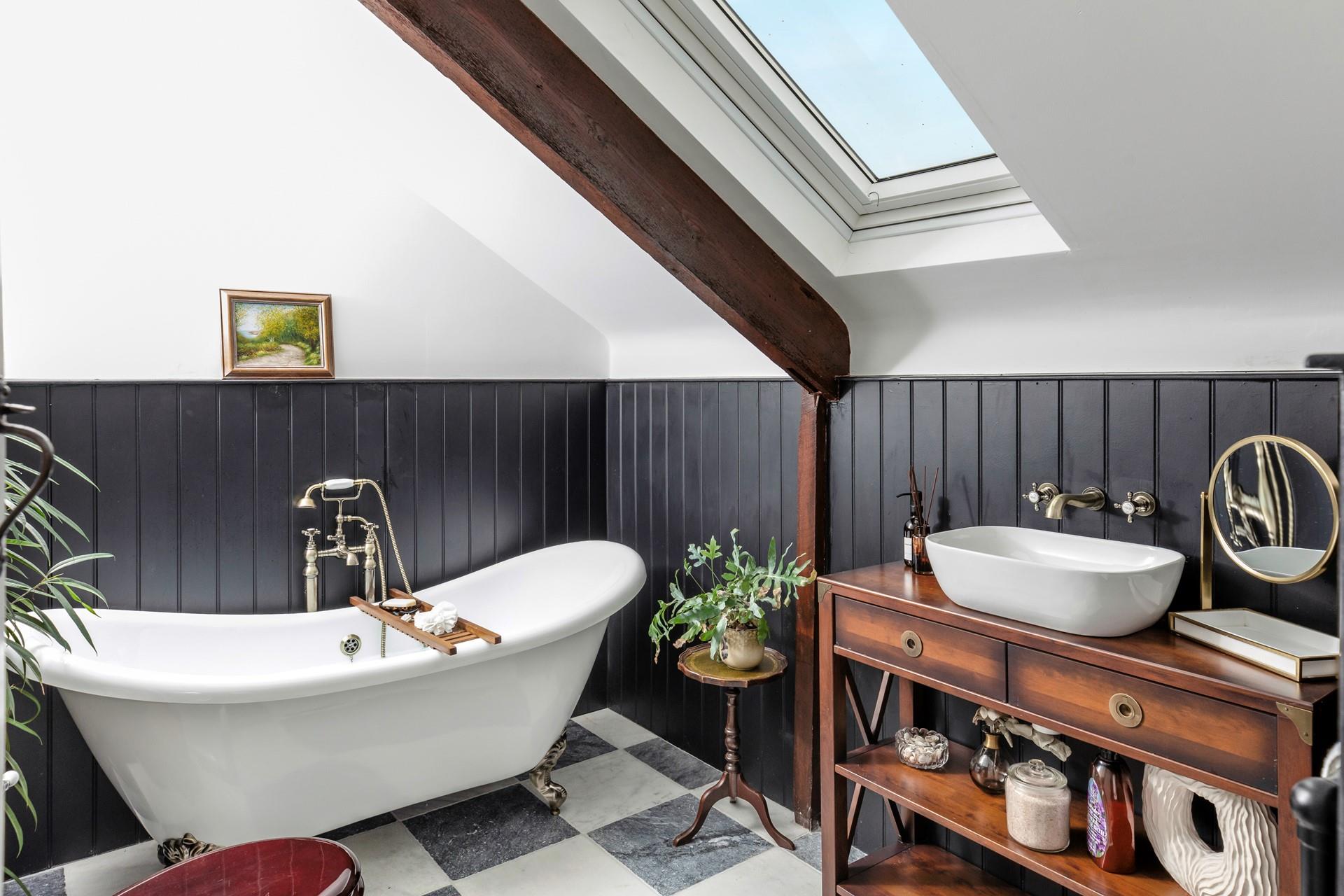 The gorgeous roll-top bath is perfect for soaking in the bubbles in the evening.