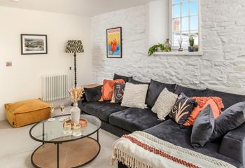 The sitting room is stylishly decorated and is a cosy base for evenings in.