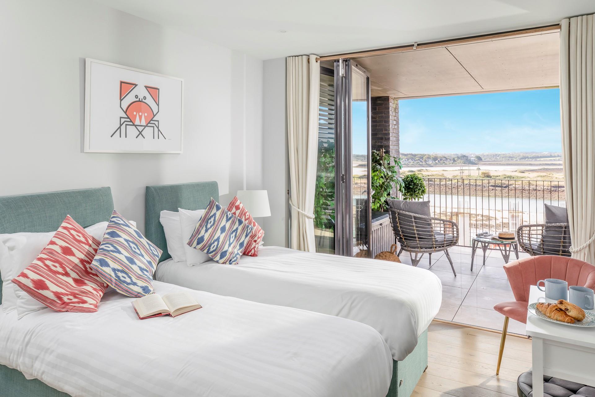 Bedroom 1 has zip and link beds and lead out onto the terrace.