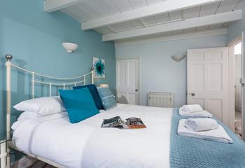 Coastal colours fill the main bedroom.