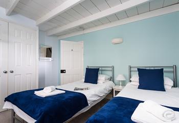 The twin room is decorated in seaside colours.