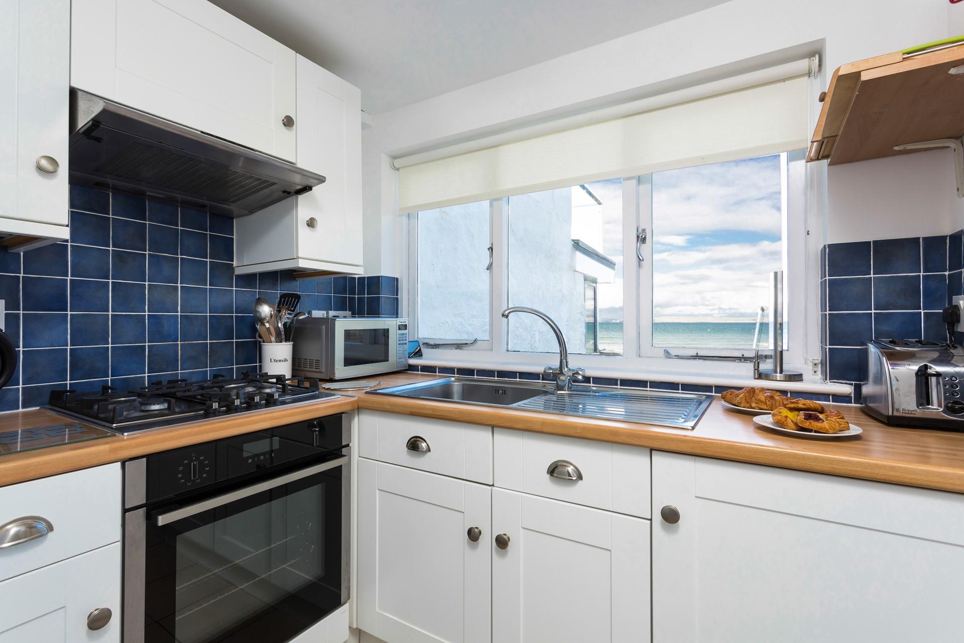 The kitchen is well equipped to prepare a nice meal.