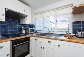 The kitchen is well equipped to prepare a nice meal.