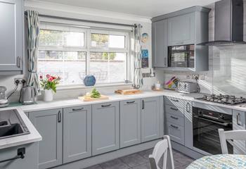 The kitchen is modern and well-equipped for cooking tasty meals. 