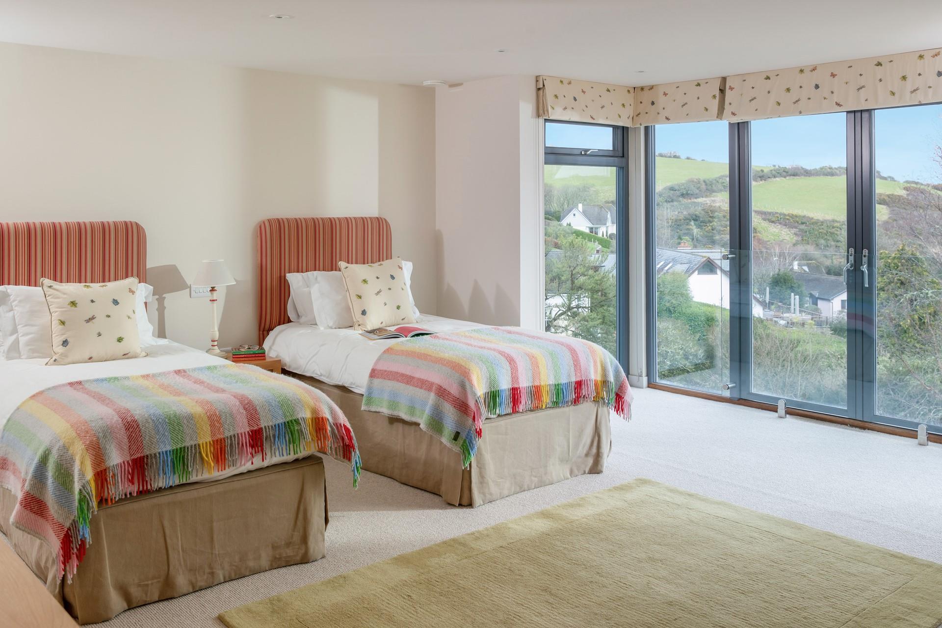 The twin bedroom has lovely sea views to wake up to.