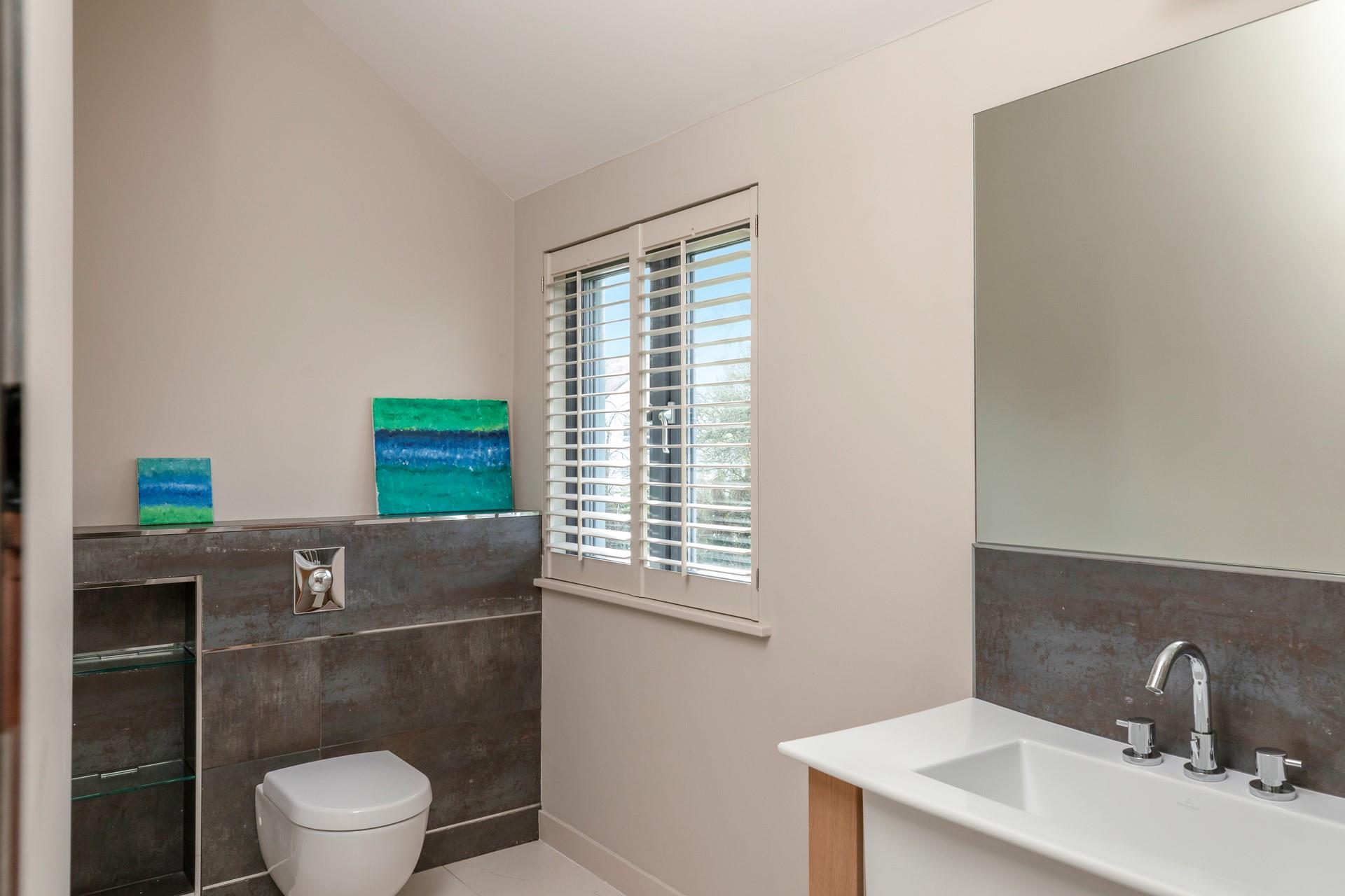 Get ready for the day in the en suite.