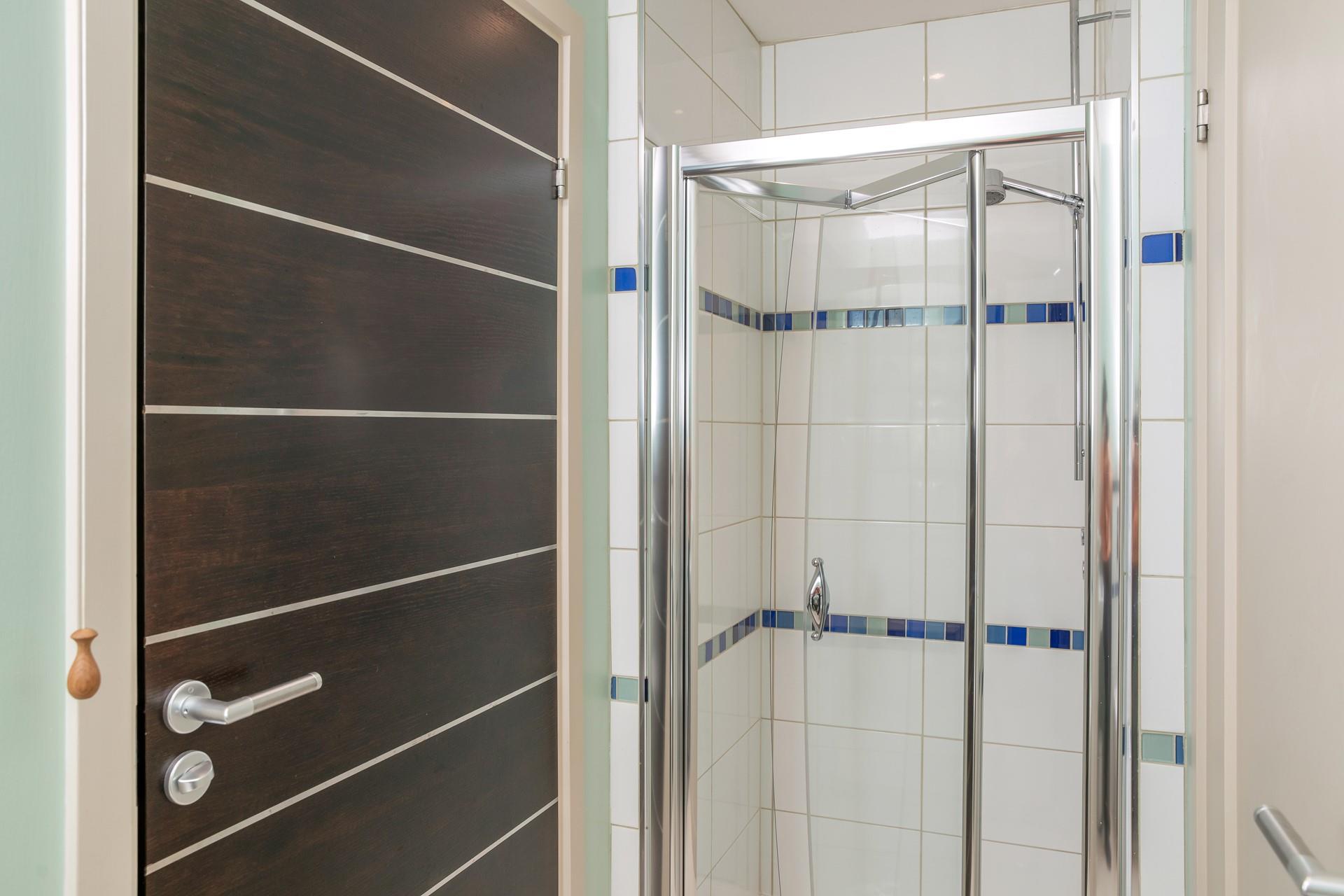 The downstairs shower room is ideal for washing off beach toes.