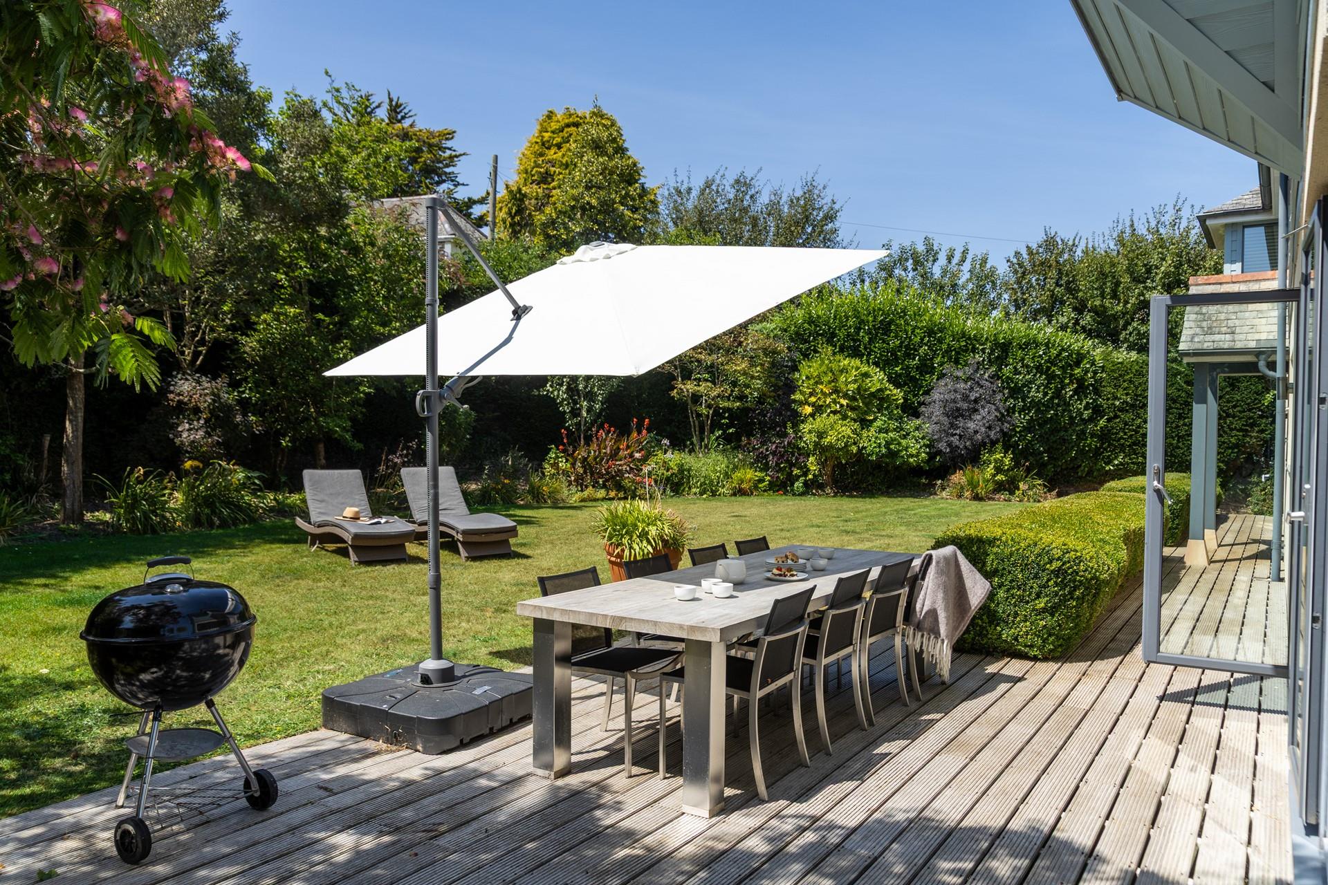 The secluded garden has plenty of space for relaxing and dining al fresco.