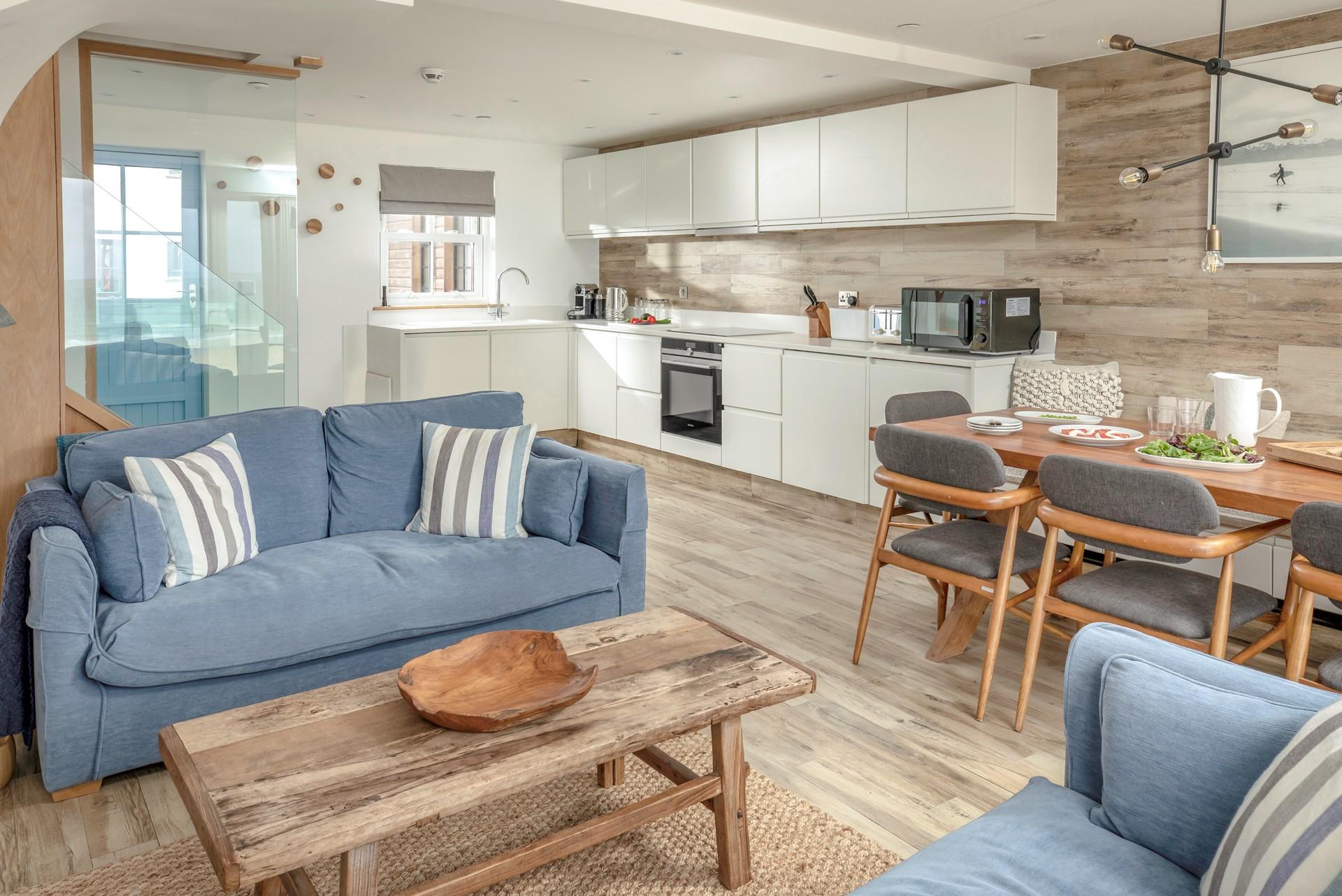 The kitchen is modern and fully equipped for cooking up a storm.