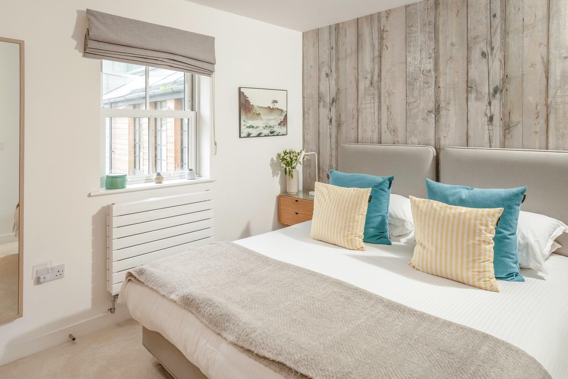 The bedrooms are decorated with coastal touches.