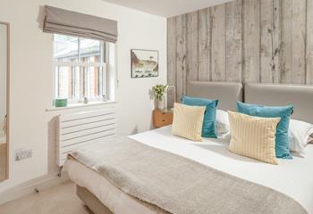 The bedrooms are decorated with coastal touches.