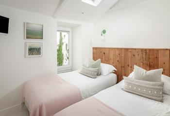 The twin bedroom is ideal for additional guests.