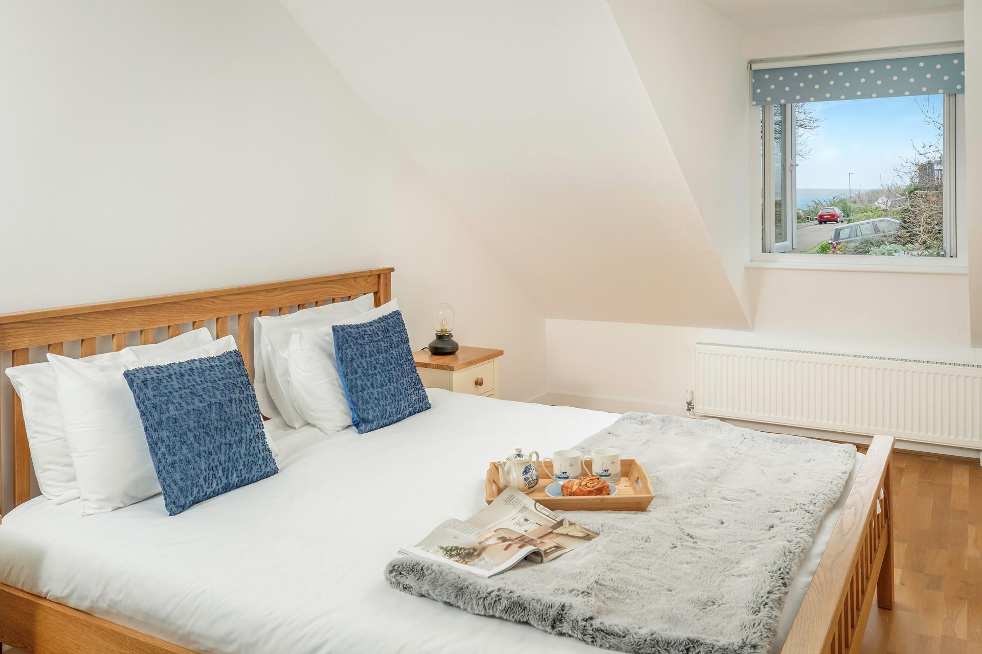 Spend a day exploring the coast path with this cosy base to return to.