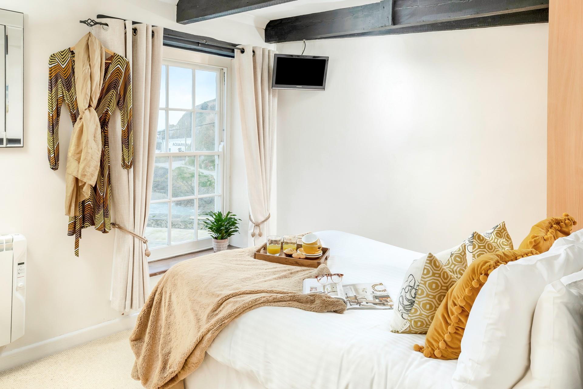 Wake up to waterside views as the tide laps the shore.