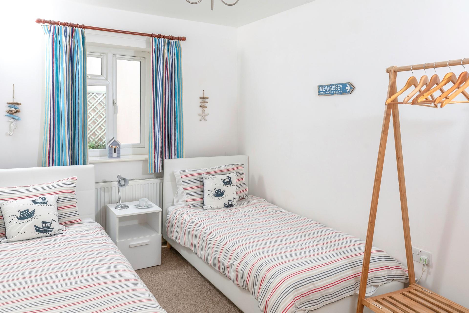 Bedroom 2 is decorated with a seaside theme.