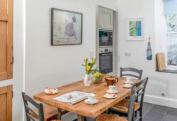 Tuck into a cup of tea and dessert at the dining table.