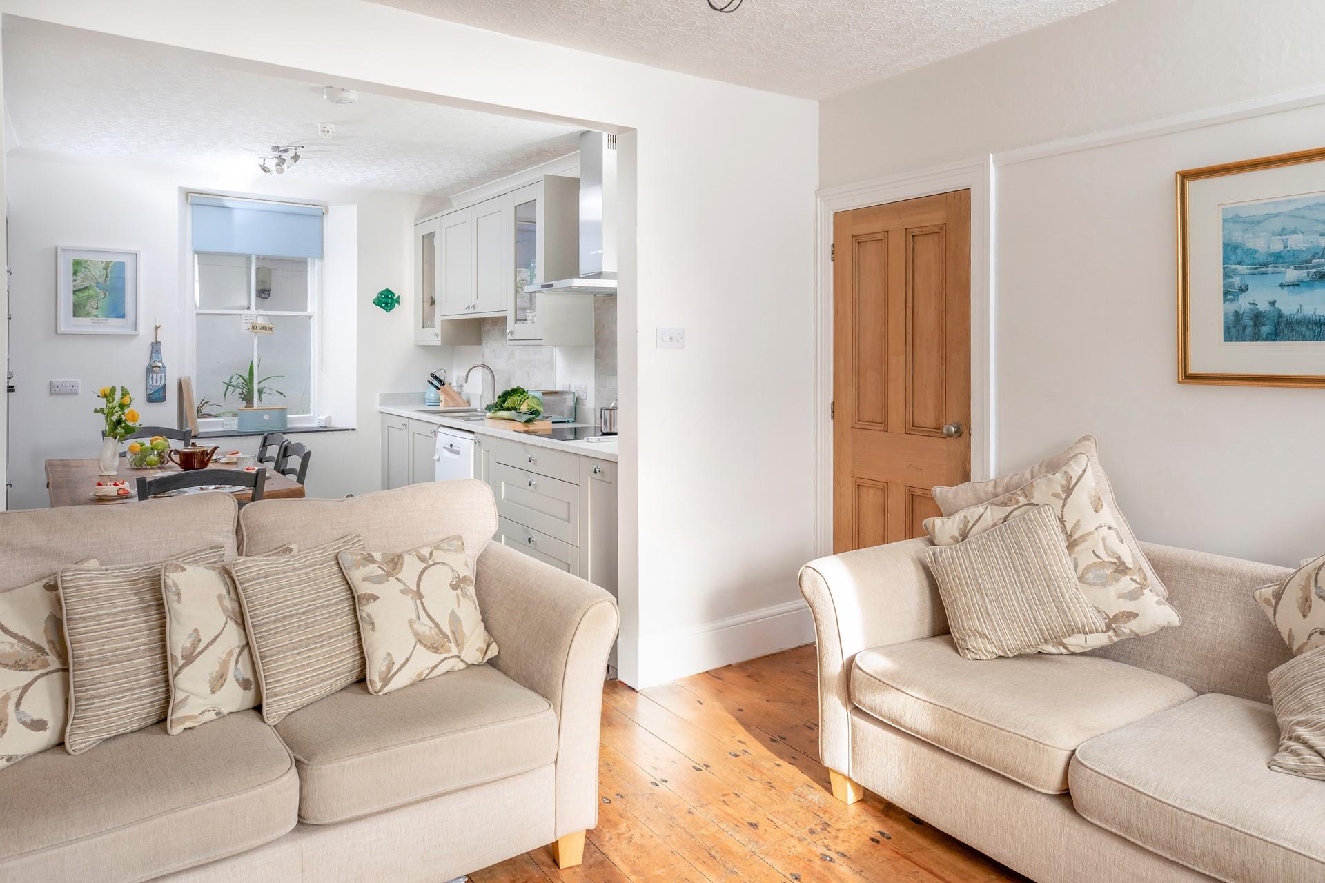 The open-plan kitchen and dining area are modern and spacious.