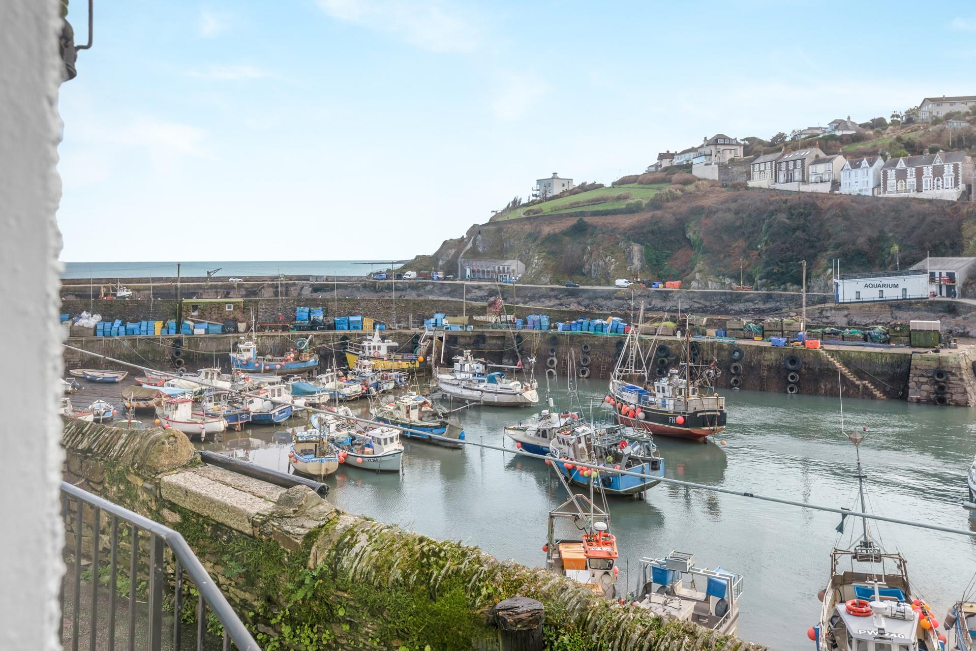 The idyllic harbour is just steps from the door.
