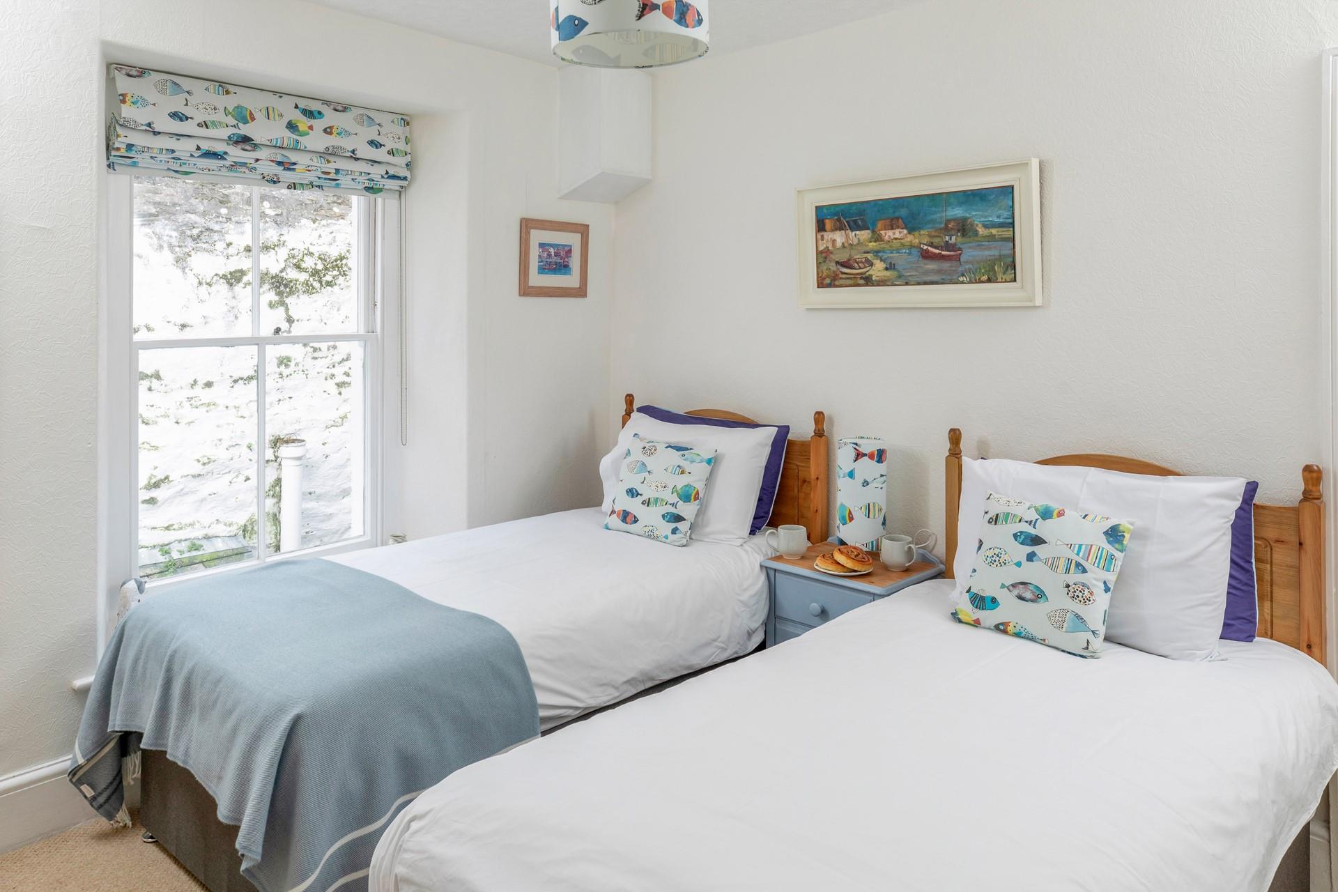 The twin bed is decorated with fun seaside patterns!