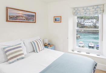 Open the blind and reveal the morning sun rising over the harbour.