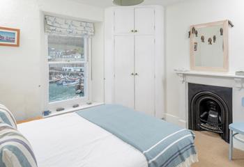 The bedrooms are full of character with the original fireplaces.