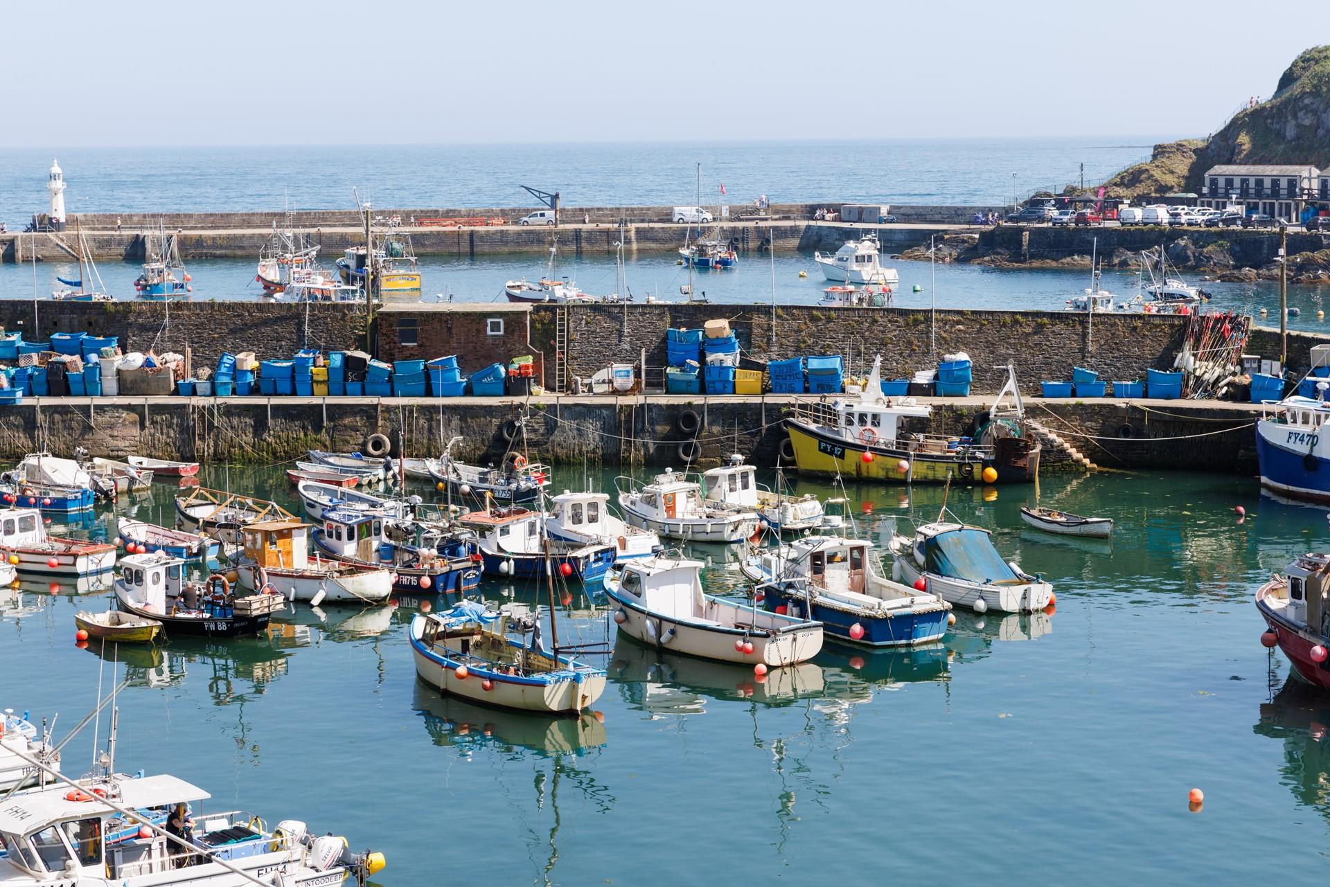 While away the hours watching colourful fishing boats bobbing in the harbour.