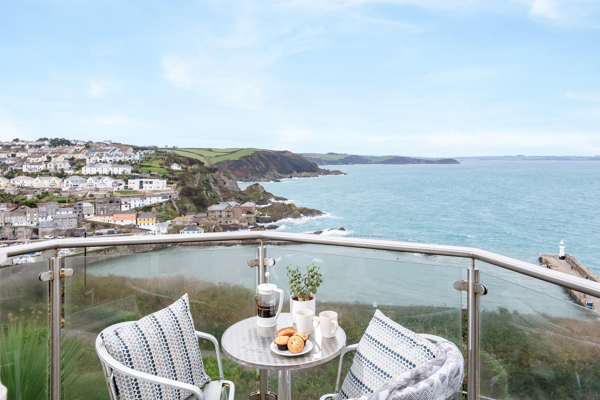 Dine al fresco, taking in the magnificent coastal view.