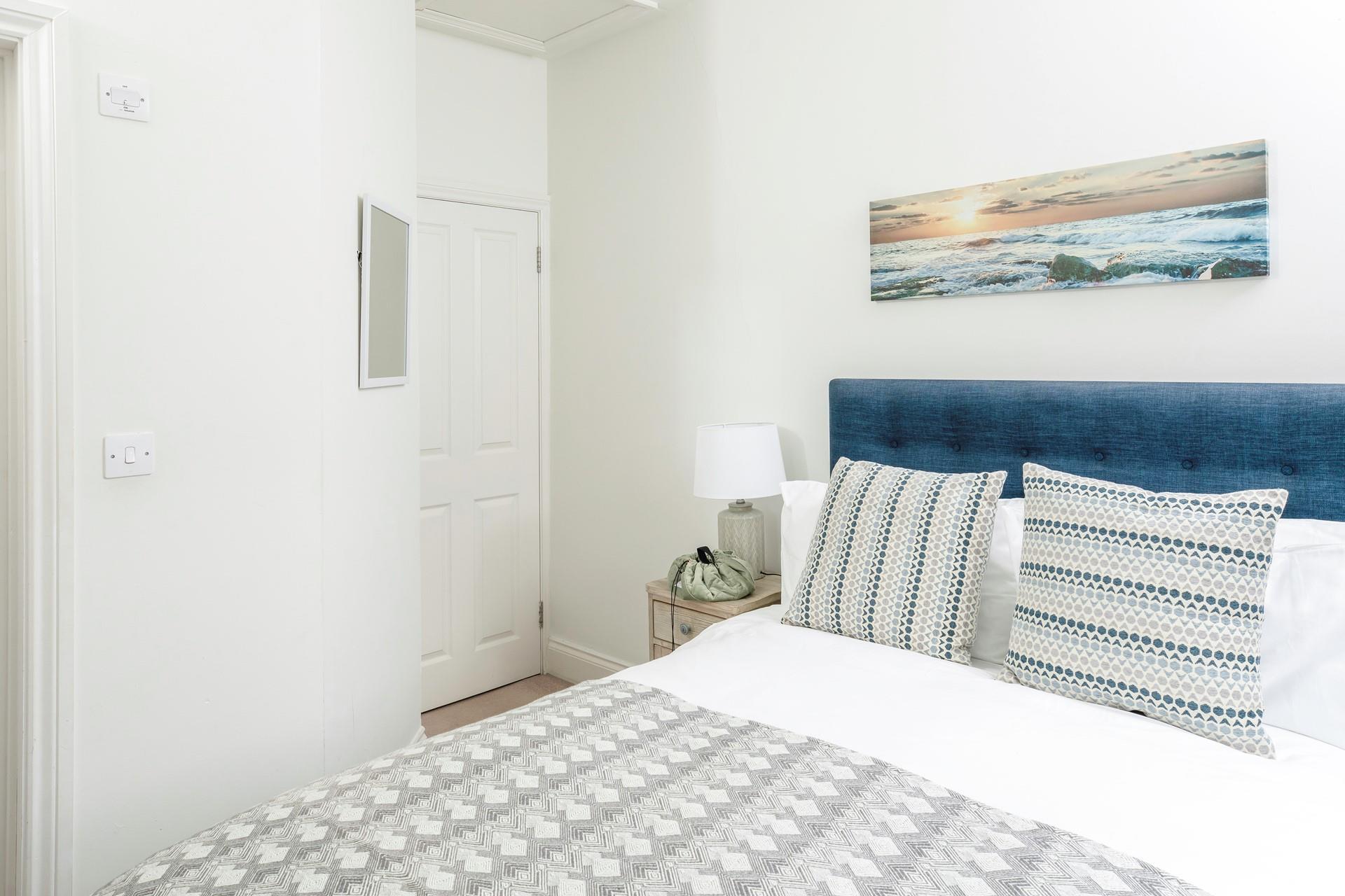 Serene coastal hues are a nod to the seaside location!