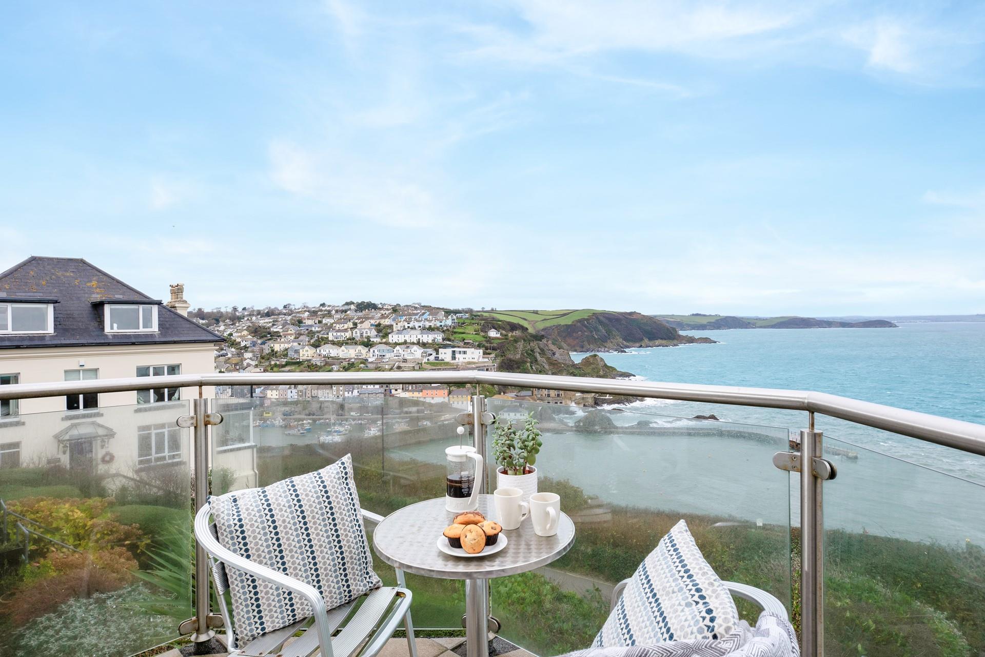 Dine al fresco, taking in the magnificent coastal view.