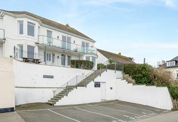 There''s parking for one car and steps up to the apartment.