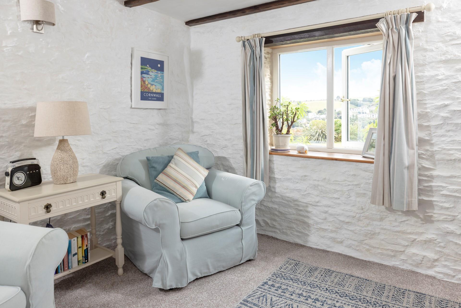 South-facing views look across pretty gardens and down to the village.