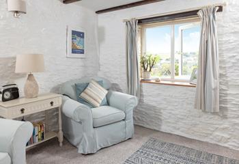 South-facing views look across pretty gardens and down to the village.