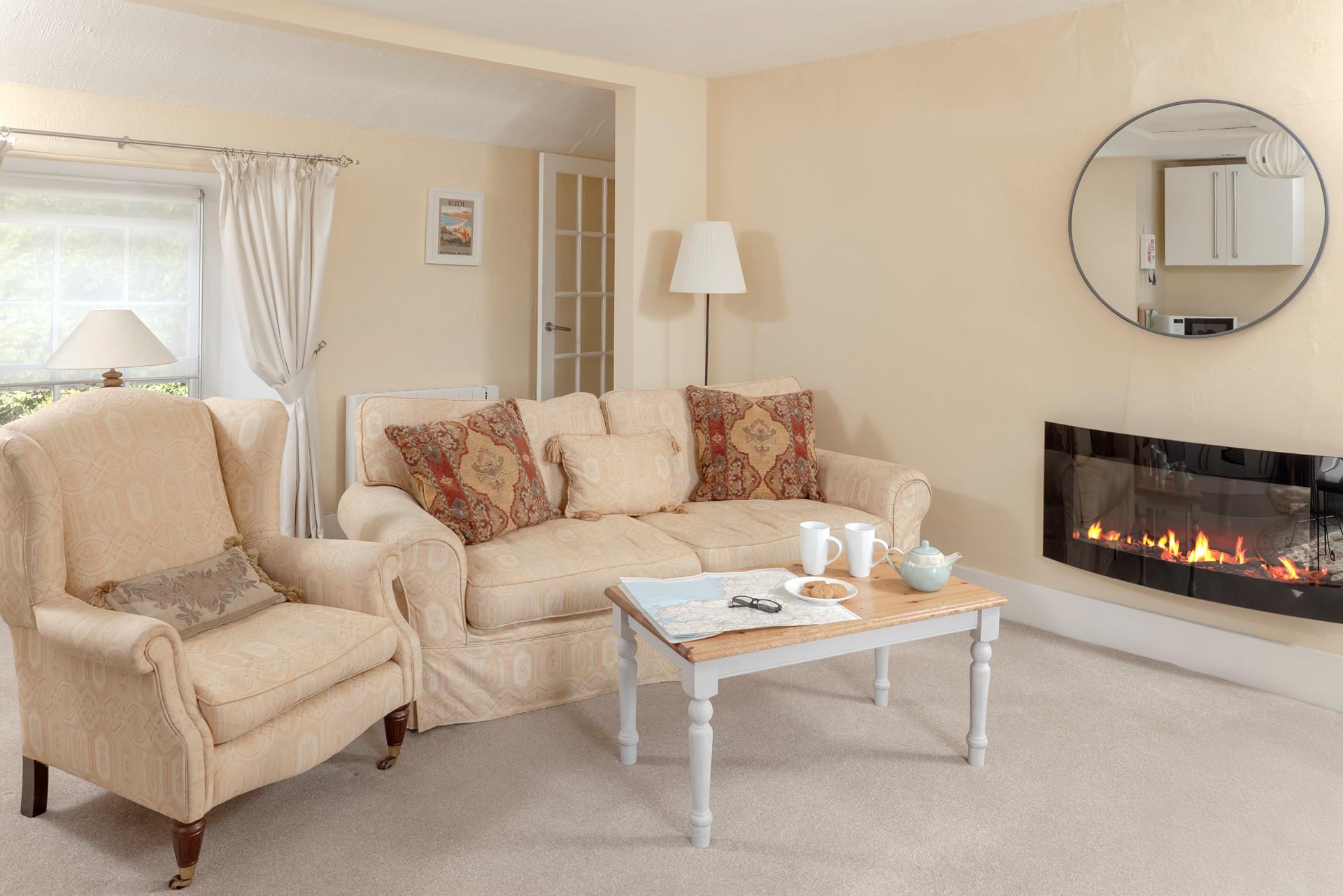 Curl up on the comfortable sofa after a day of exploring the nearby coastal paths.