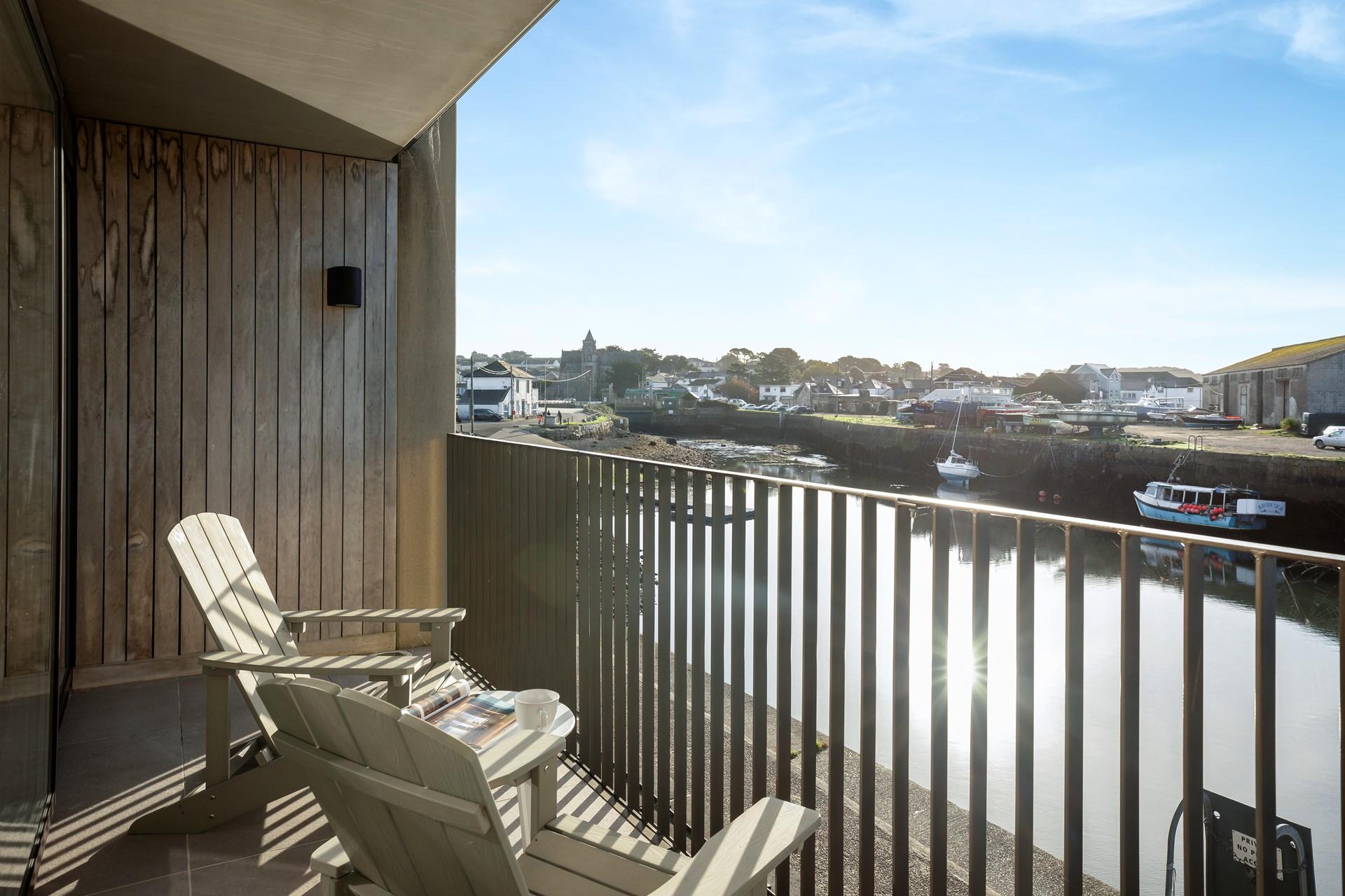 Watch the boats bob on the water from the balcony.