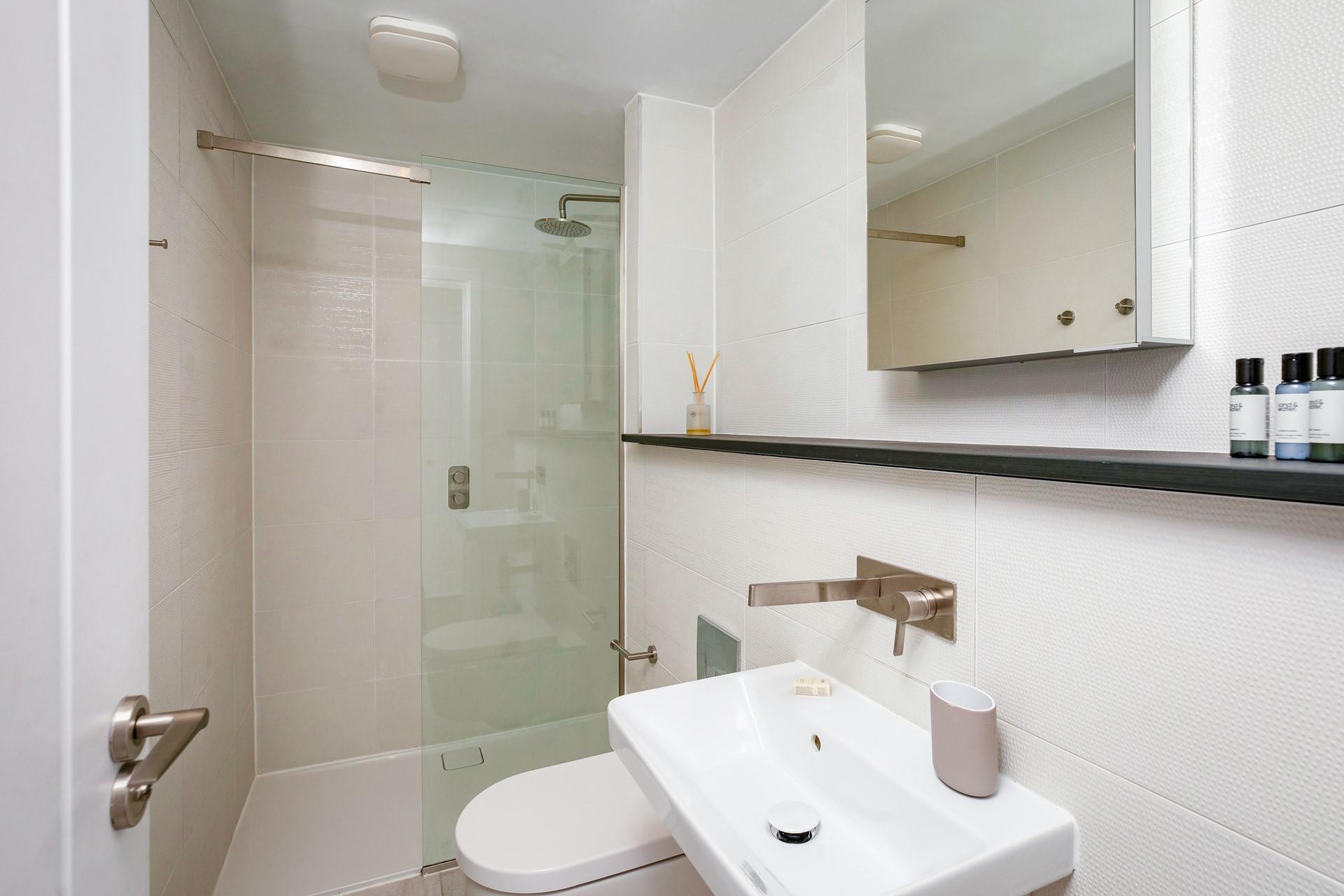 Wash off sandy toes in the en suite shower room.