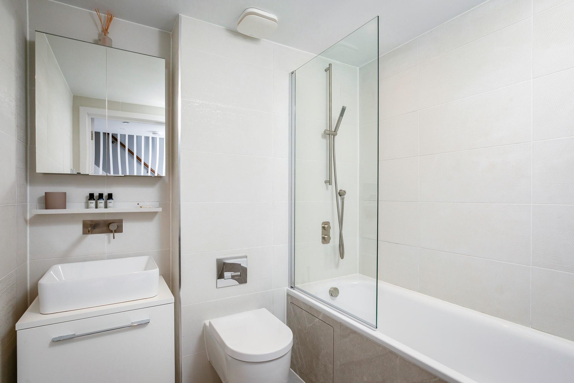The family bathroom is modern and luxurious.