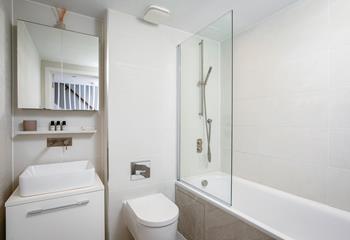 The family bathroom is modern and luxurious.