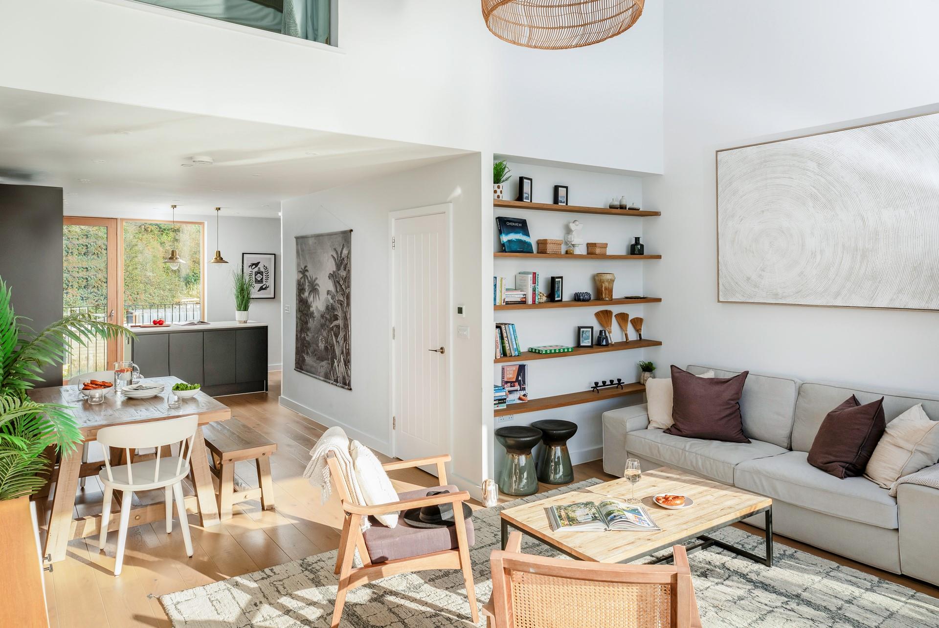 The living space is stylishly decorated with calming coastal decor.