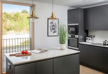 The kitchen is spacious and sleek.