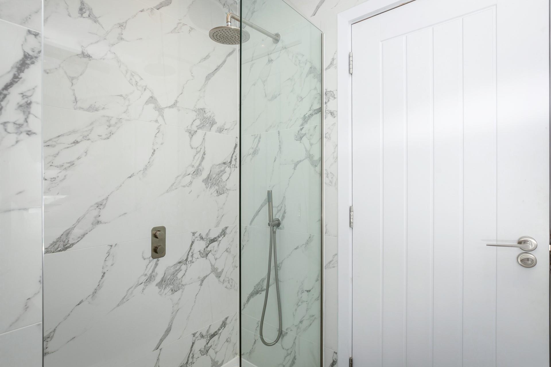 Wash off sandy toes in the shower after a beach day.