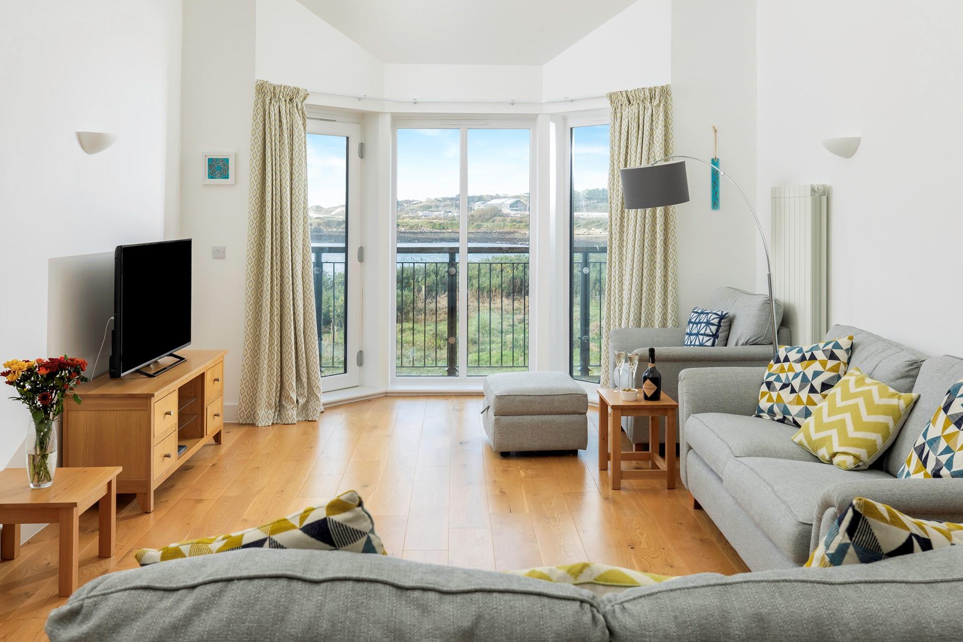 The open plan living space takes advantage of the estuary views.