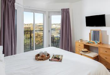 Enjoy the views from the spacious bedroom.